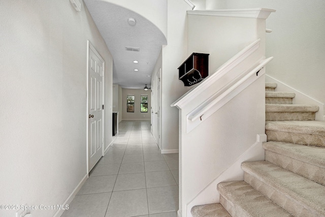 1425 Lara Cir Unit 103, Rockledge, FL 32955 - hallway featuring light tile patterned floors, stairs, and recessed lighting