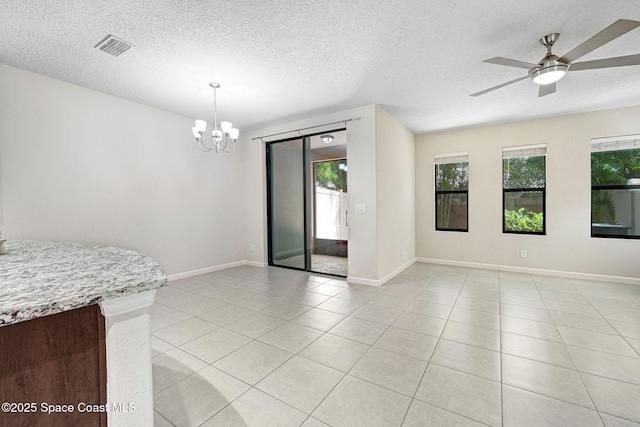1425 Lara Cir Unit 103, Rockledge, FL 32955 - unfurnished room featuring a textured ceiling, a chandelier, light tile patterned flooring, and ceiling fan