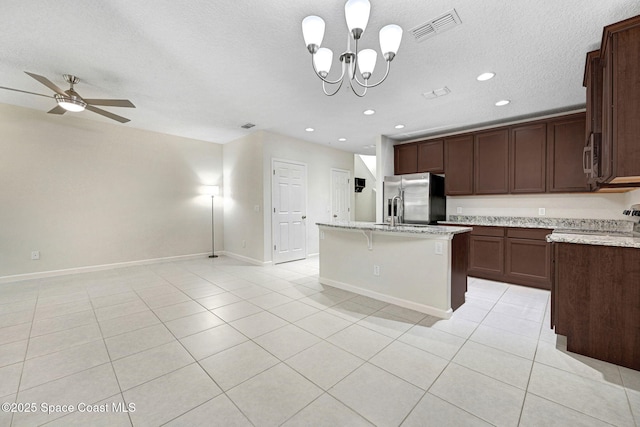 1425 Lara Cir Unit 103, Rockledge, FL 32955 - kitchen with stainless steel appliances, light tile patterned floors, open floor plan, a center island, and ceiling fan