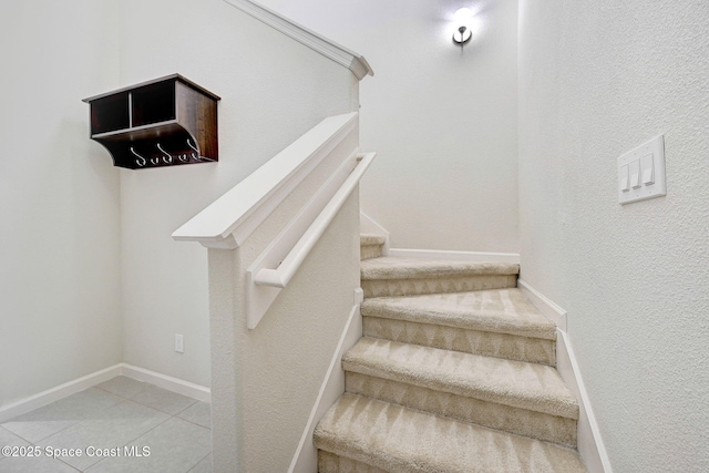 1425 Lara Cir Unit 103, Rockledge, FL 32955 - stairs featuring tile patterned floors and a textured wall