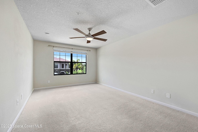 1425 Lara Cir Unit 103, Rockledge, FL 32955 - empty room featuring a ceiling fan, a textured ceiling, and light carpet