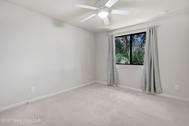 1425 Lara Cir Unit 103, Rockledge, FL 32955 - spare room featuring carpet flooring, ceiling fan, and a textured ceiling