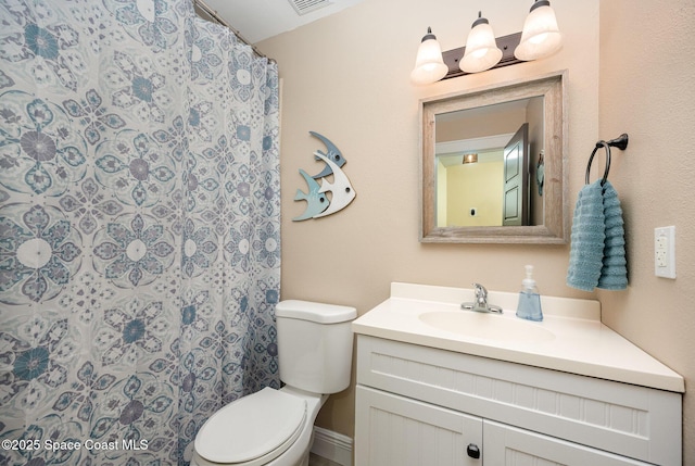 full bath with visible vents, vanity, and toilet