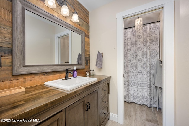 bathroom featuring vanity and wood finished floors