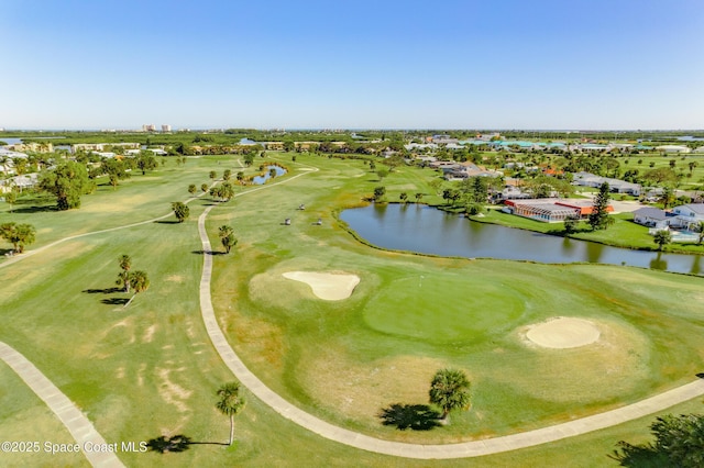 bird's eye view featuring golf course view and a water view