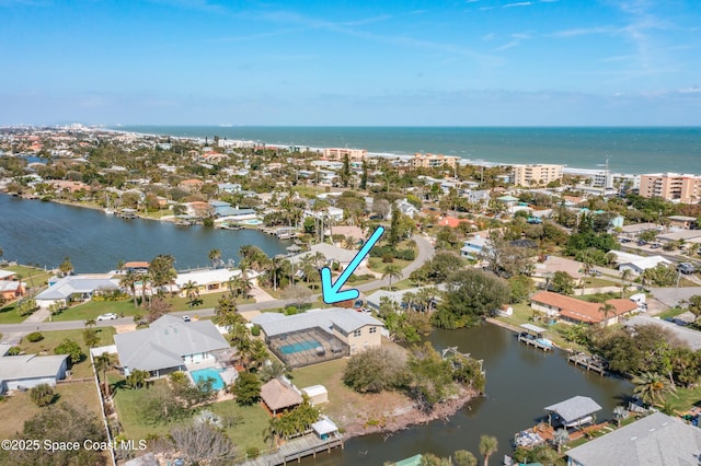 aerial view with a residential view and a water view