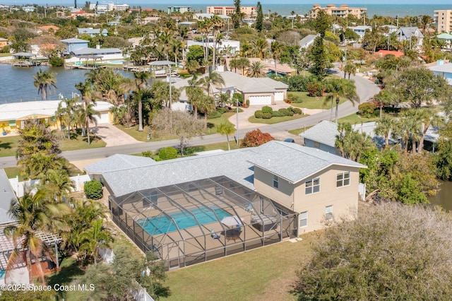 bird's eye view featuring a water view and a residential view