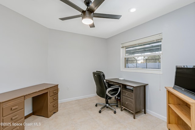 office featuring light tile patterned flooring, ceiling fan, and baseboards