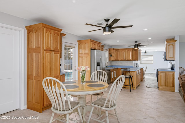 dining room featuring light tile patterned floors, recessed lighting, visible vents, a ceiling fan, and baseboards