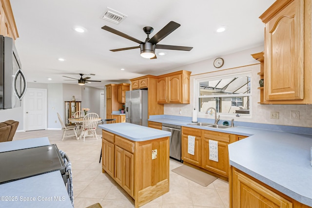 kitchen with appliances with stainless steel finishes, a sink, visible vents, and recessed lighting