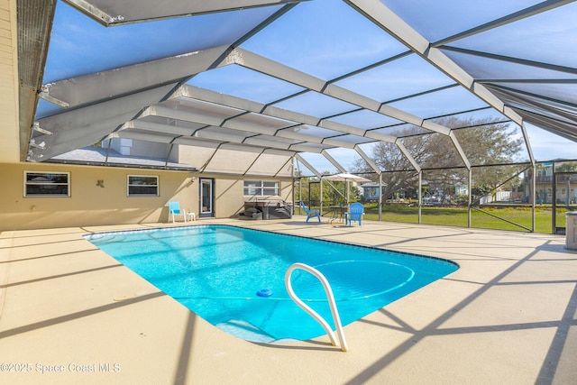 pool with a lanai and a patio