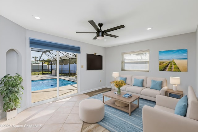 living area featuring a ceiling fan, recessed lighting, a sunroom, and baseboards