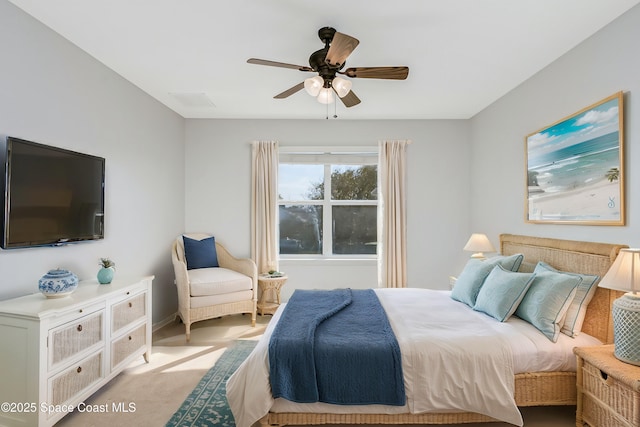 bedroom with ceiling fan, carpet floors, and baseboards