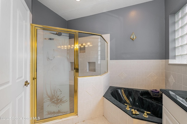 bathroom with vanity and independent shower and bath