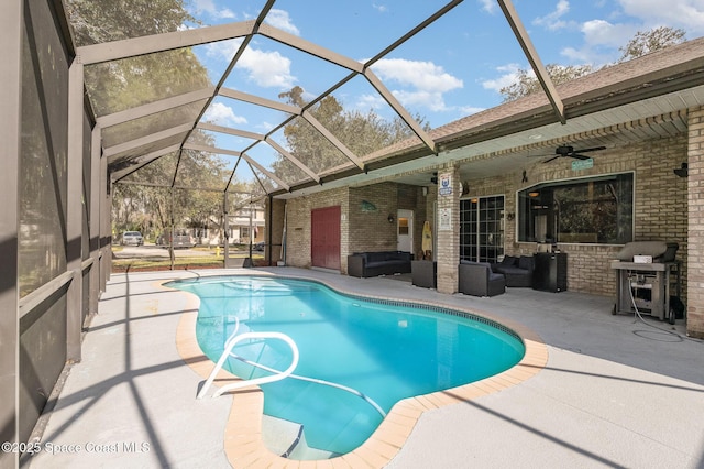 view of swimming pool featuring outdoor lounge area, a lanai, grilling area, ceiling fan, and a patio area