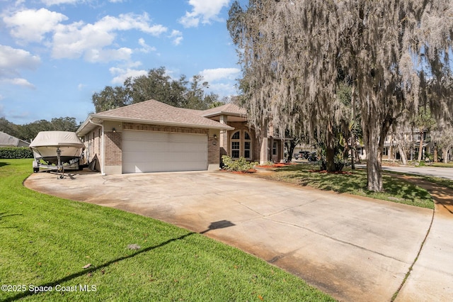 view of front of home featuring a garage and a front lawn