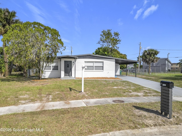 single story home with a carport and a front lawn