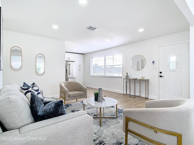 living room with light hardwood / wood-style flooring