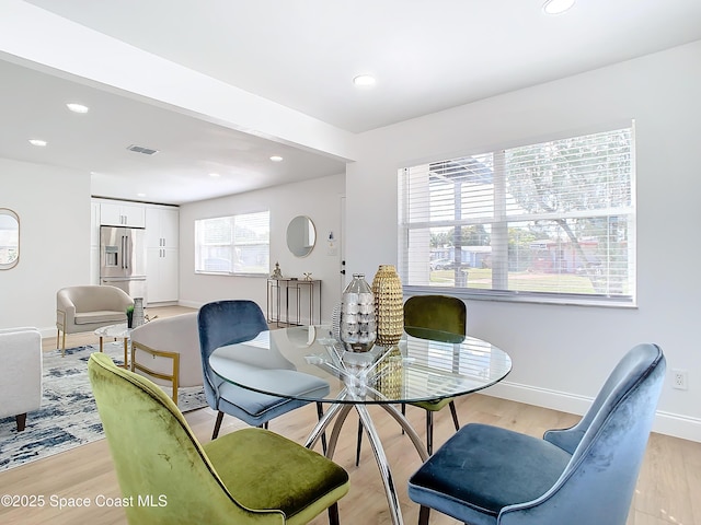 dining room with light hardwood / wood-style flooring