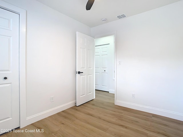 unfurnished bedroom featuring light hardwood / wood-style floors and ceiling fan