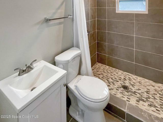 bathroom with vanity, toilet, and a shower with shower curtain