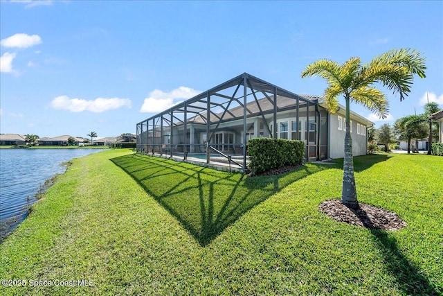 view of yard featuring a lanai and a water view