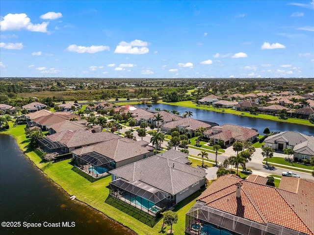 birds eye view of property featuring a water view