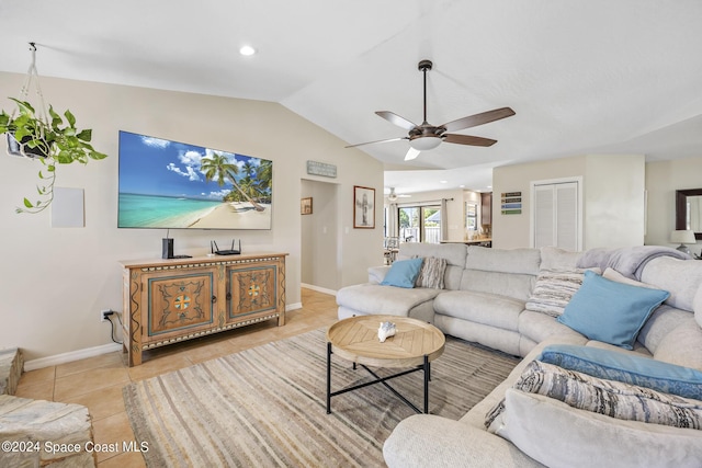 living room featuring light tile patterned flooring, vaulted ceiling, and ceiling fan