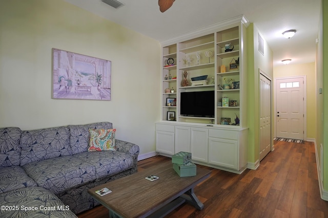 7831 Winona Rd, Melbourne Beach, FL 32951 - living area featuring dark wood-style flooring and baseboards