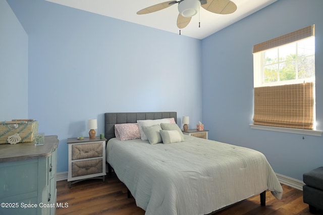 7831 Winona Rd, Melbourne Beach, FL 32951 - bedroom with dark wood-style floors and ceiling fan