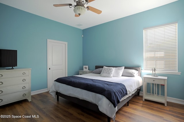 7831 Winona Rd, Melbourne Beach, FL 32951 - bedroom with wood finished floors and ceiling fan