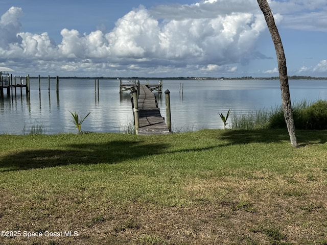 7831 Winona Rd, Melbourne Beach, FL 32951 - dock featuring a yard and a water view