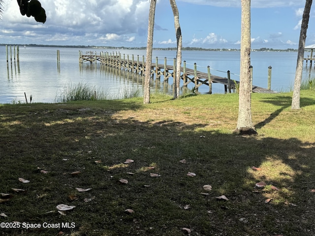7831 Winona Rd, Melbourne Beach, FL 32951 - dock featuring a water view and a lawn
