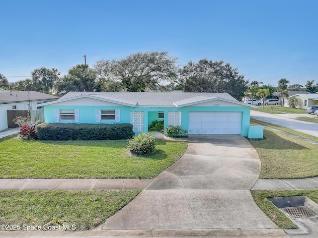 ranch-style home with a garage and a front lawn