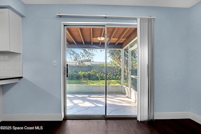 doorway to outside featuring wood-type flooring