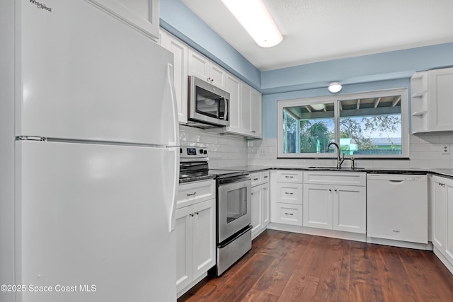 kitchen featuring white cabinetry, sink, and appliances with stainless steel finishes