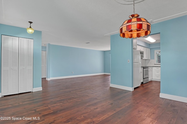 unfurnished living room featuring dark wood-type flooring