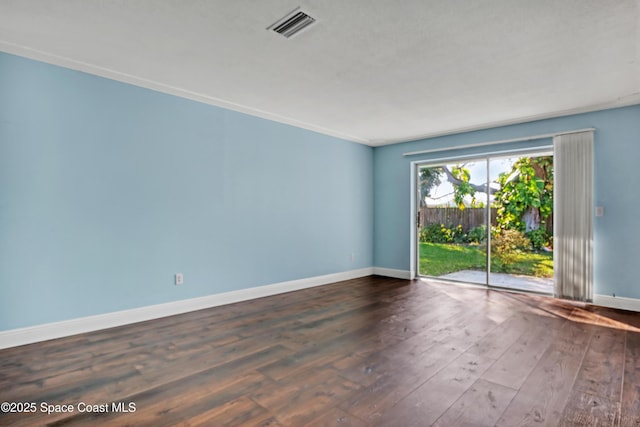 empty room with dark hardwood / wood-style flooring