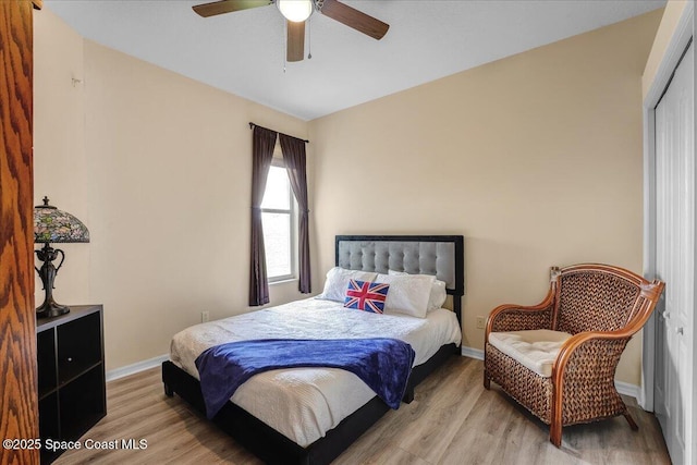 bedroom featuring ceiling fan and light hardwood / wood-style floors