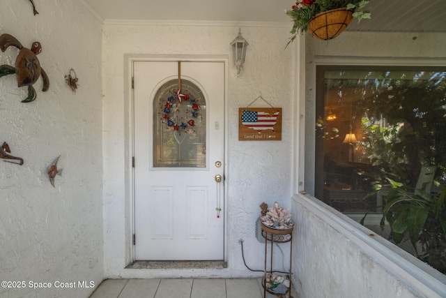 property entrance featuring stucco siding