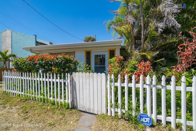 view of home's exterior with a fenced front yard