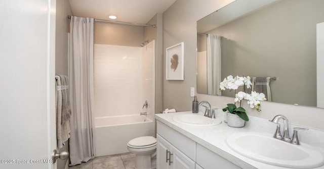 full bathroom featuring vanity, tub / shower combination, tile patterned floors, and toilet