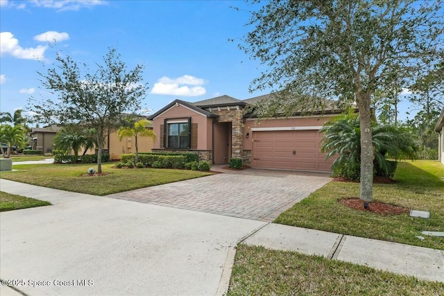 view of front of house with a garage and a front lawn