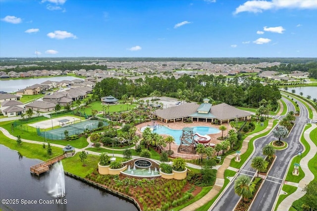 birds eye view of property with a water view and a residential view