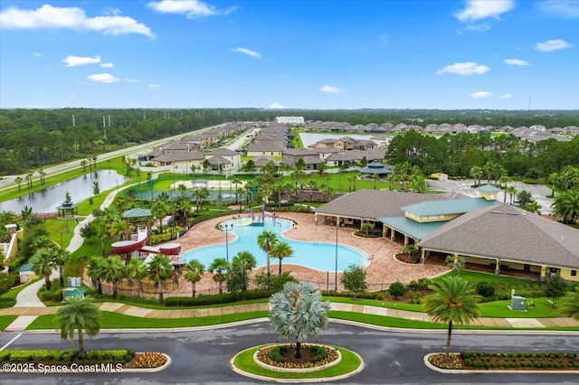 birds eye view of property featuring a water view and a residential view
