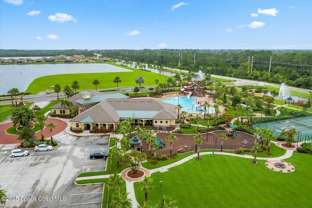 birds eye view of property with a water view