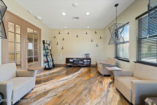 interior space featuring visible vents, baseboards, recessed lighting, wood finished floors, and french doors