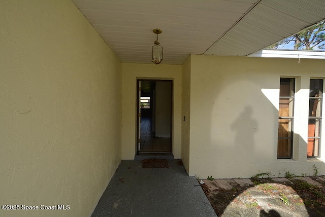 doorway to property with stucco siding