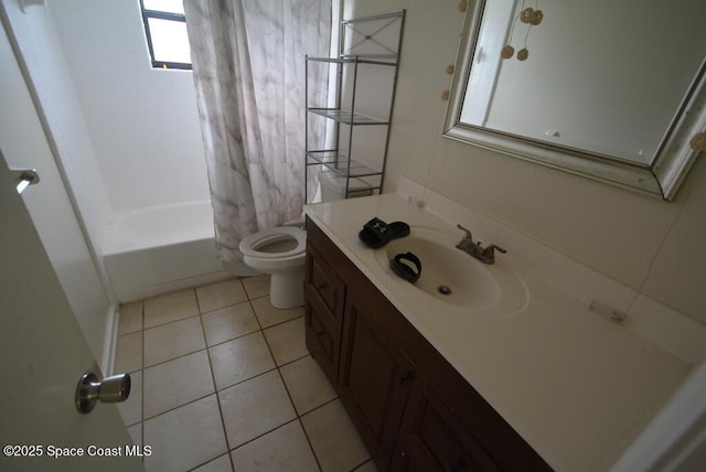 full bath with toilet, shower / bath combo, vanity, and tile patterned floors