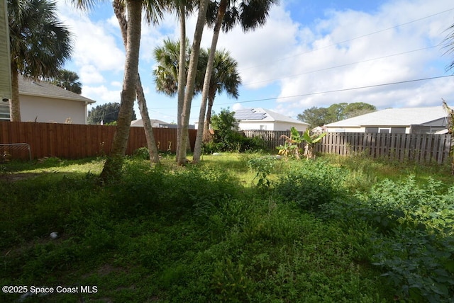 view of yard with a fenced backyard